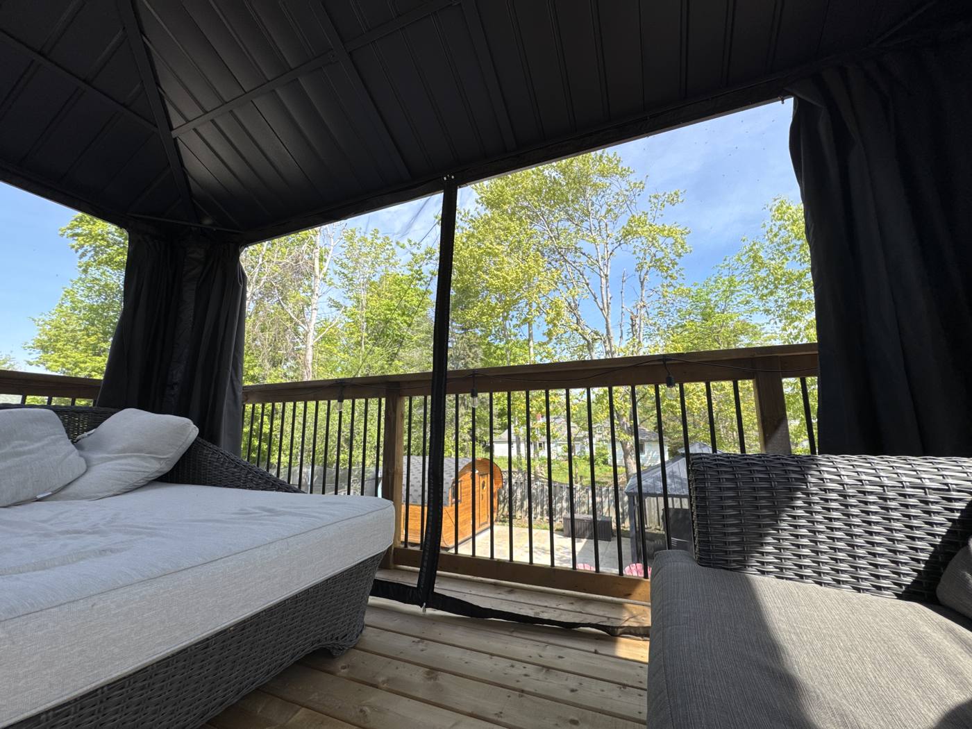 Lounge seating under the deck gazebo in summer