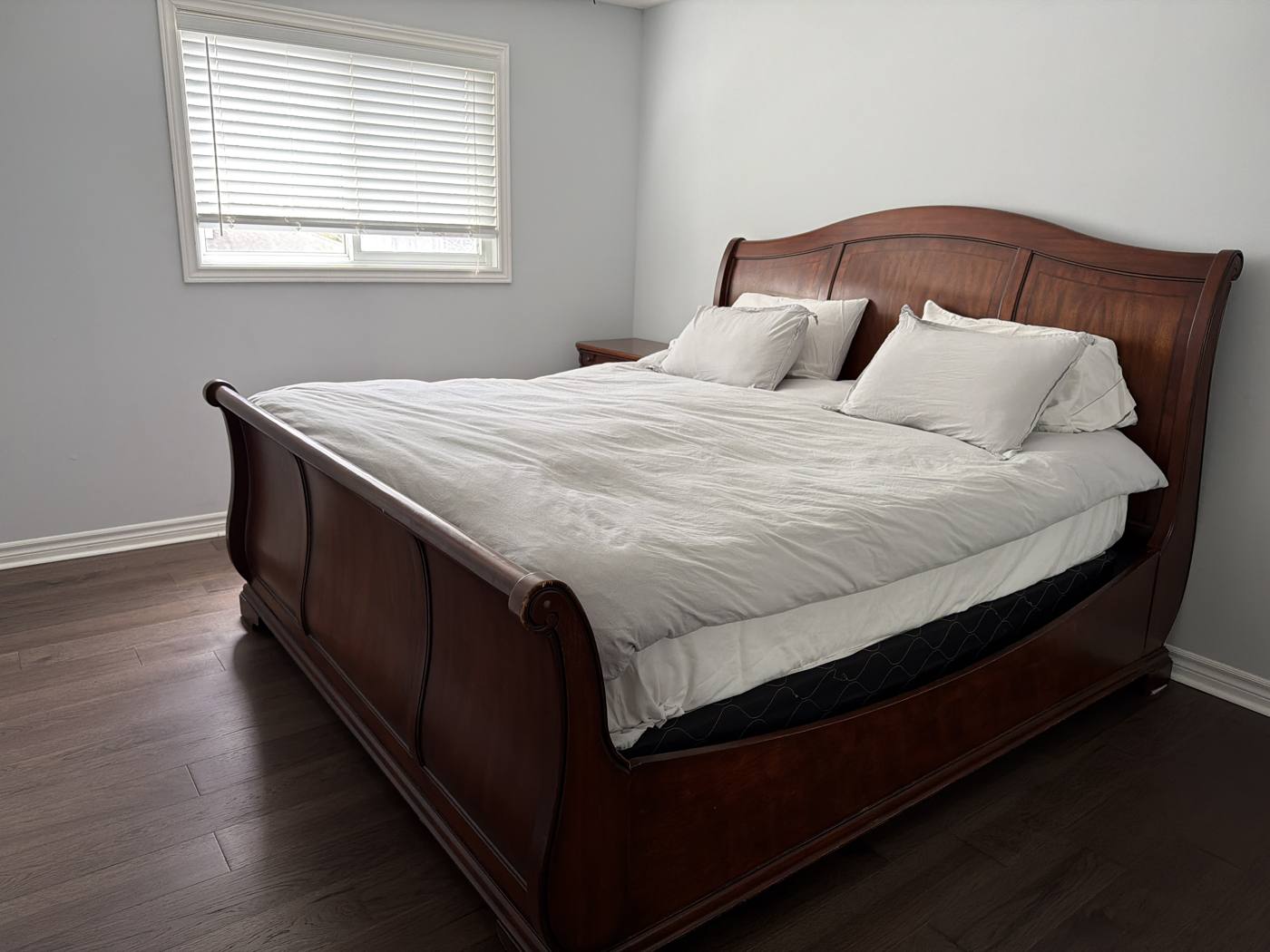 King bedroom with sleigh bed at the Innisfil cottage